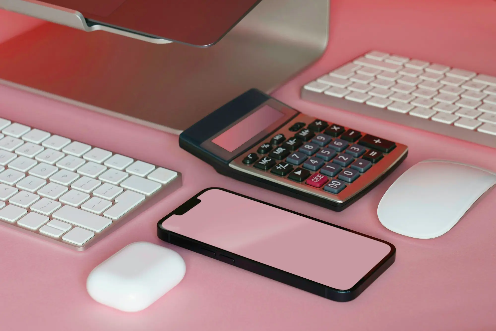 Smartphone, calculator and keyboards on a desk, ready to download platform earnings statements for a loan application